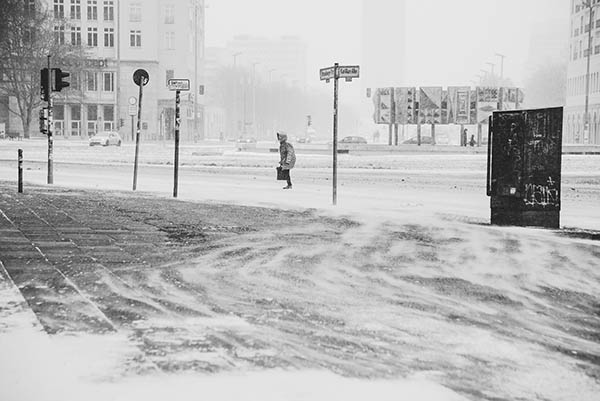 PMDD during winter months shows woman struggling in the snow